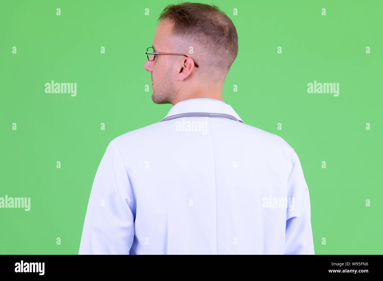 Male doctor looking green screen hi-res stock photography and images ...