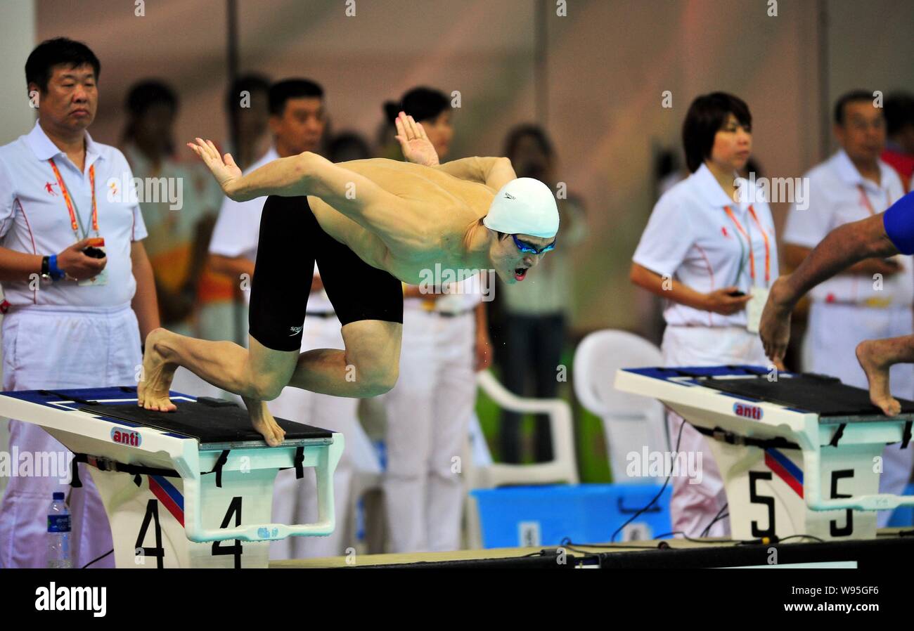Chinese Olympic swimming champion Sun Yang jumps into the water in the ...