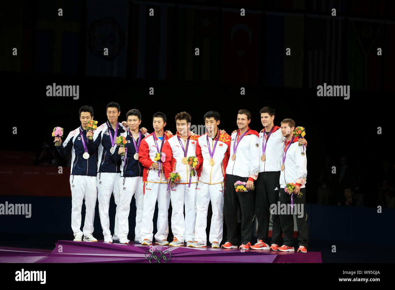 (From left to right) Silver medalists of South Korea, gold medalists of China and bronze medalists of Germany pose on the podium in the award ceremony Stock Photo