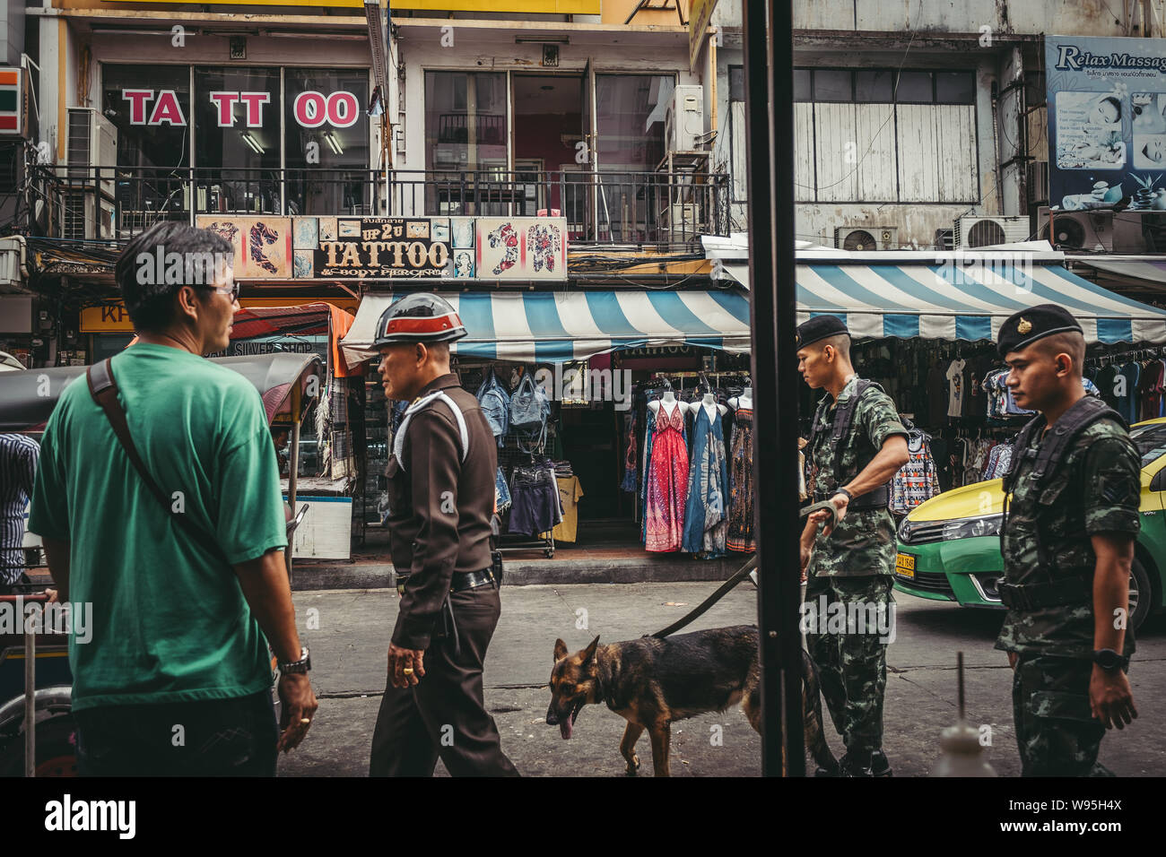 police officers patrolling with dog in bangkok Stock Photo Alamy