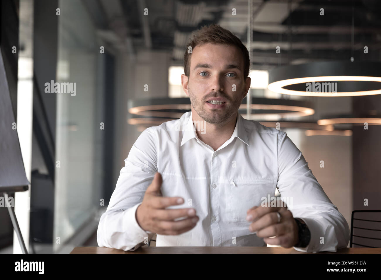 Businessman making video call, looking at camera and talking Stock Photo -  Alamy