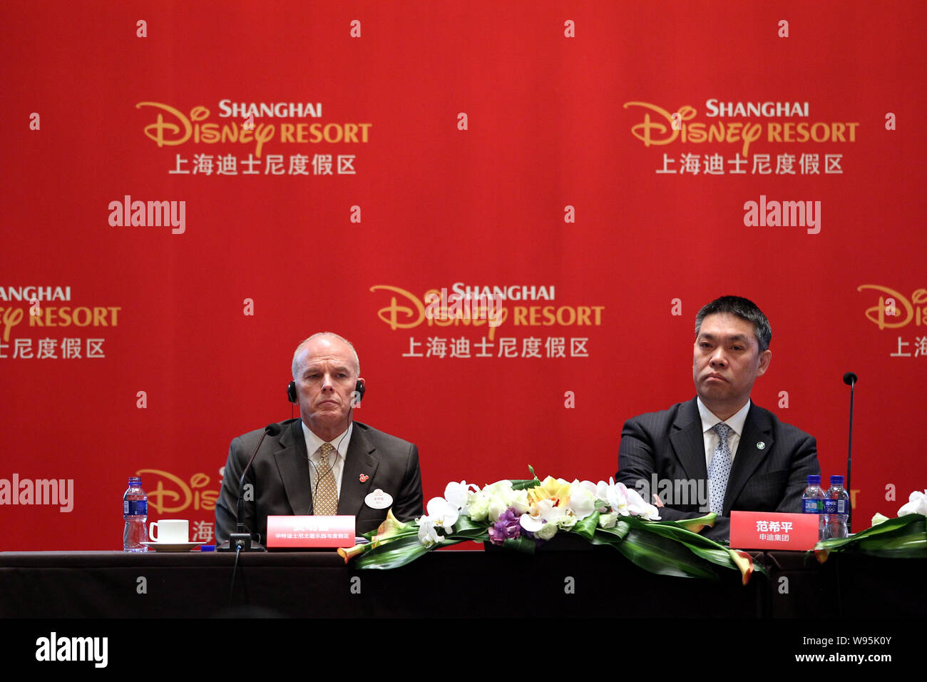 Bill Ernest, left, President and Managing Director for Asia of Walt Disney Parks & Resorts, and Fan Xiping, Chairman of Shanghai Shendi Group Corp., a Stock Photo