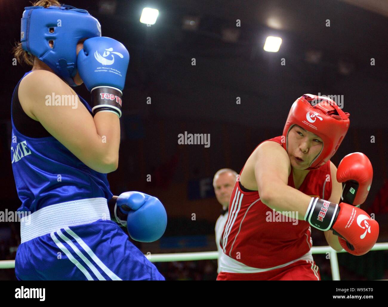 Chess boxers Arik Braun (R) and Felix Bartels sit in front of a chequer  board during the Chess Boxing Championships in Berlin, Germany, 28 July  2012. The chess boxing event took place