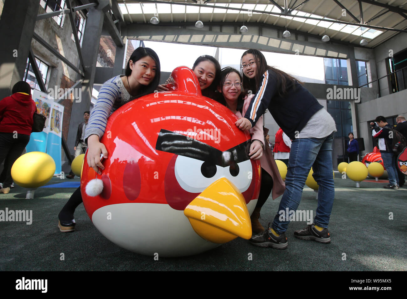 Young Women Pose With An Angry Bird At The Angry Birds Theme Park In Shanghai Tongji University In Shanghai China 31 October 12 Chinas First An Stock Photo Alamy