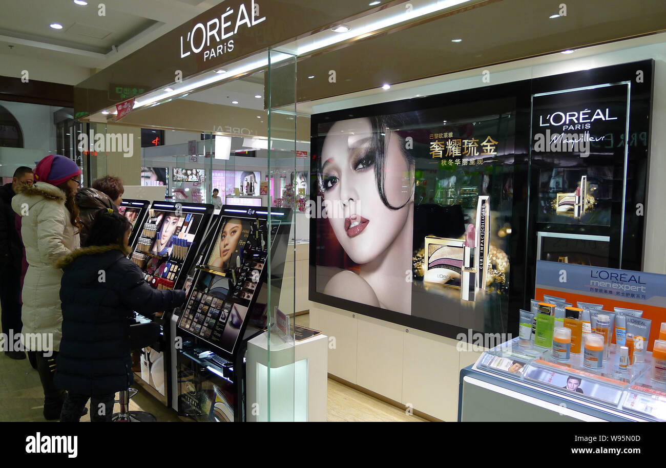 File--Customers shop for LOreal products at a store in Qingdao, east Chinas  Shandong province, 10 December 2011. LOreal China has published its an  Stock Photo - Alamy