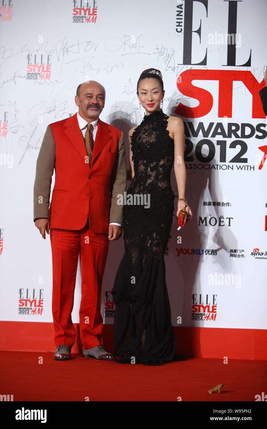French footwear designer Christian Louboutin, left, poses with ...