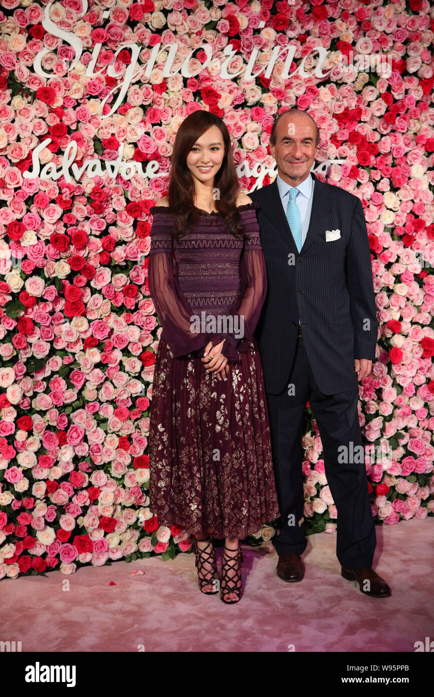 Chinese actress Tiffany Tang Yan, left, poses with Michele Norsa, CEO of Salvatore  Ferragamo SpA, during a launch ceremony for the Salvatore Ferragamo Stock  Photo - Alamy