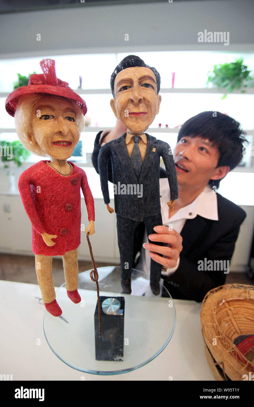Chinese Hairstylist Huang Xin Puts Final Touches On His Hair Made