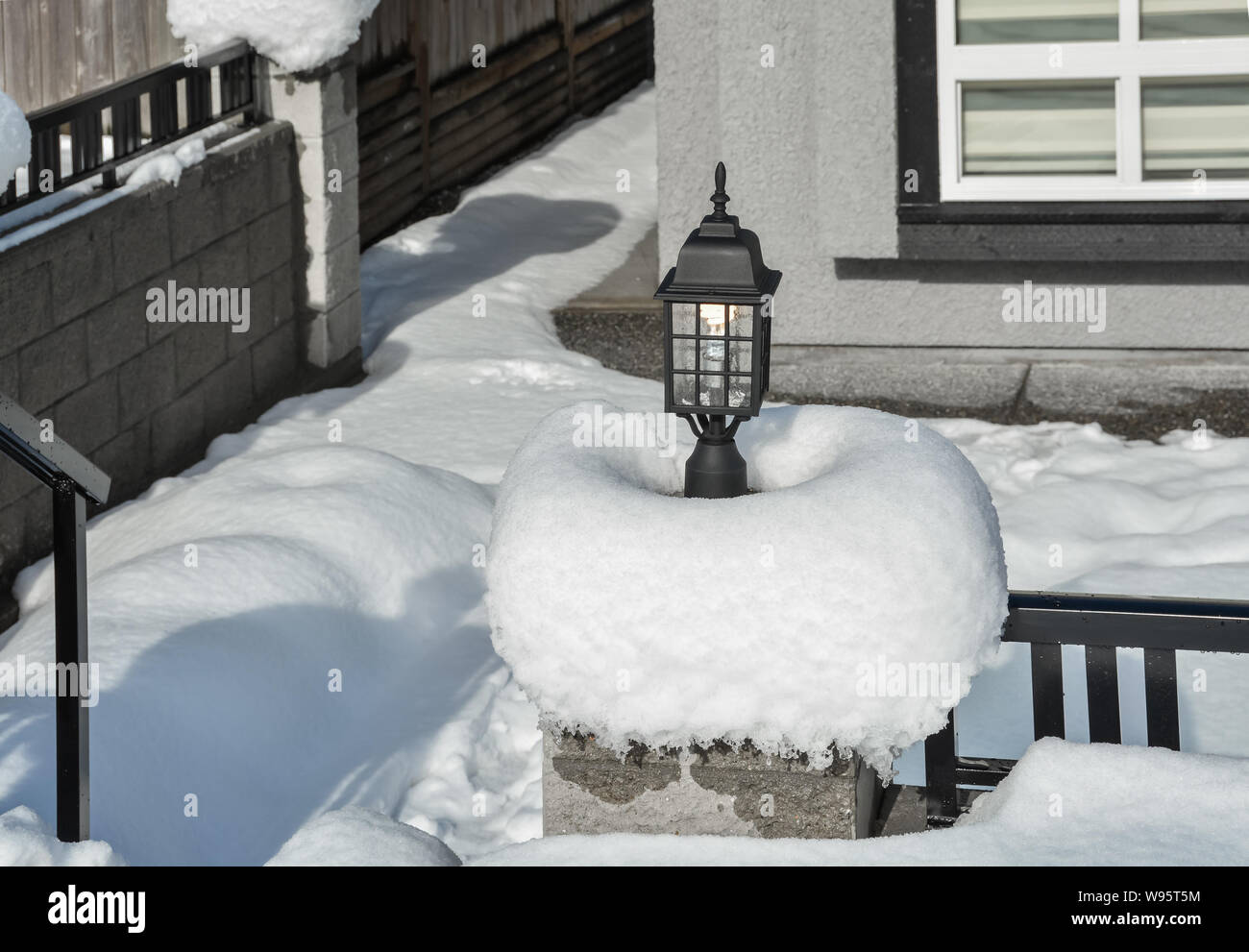 Street light in snow. Small architecture form. Stock Photo