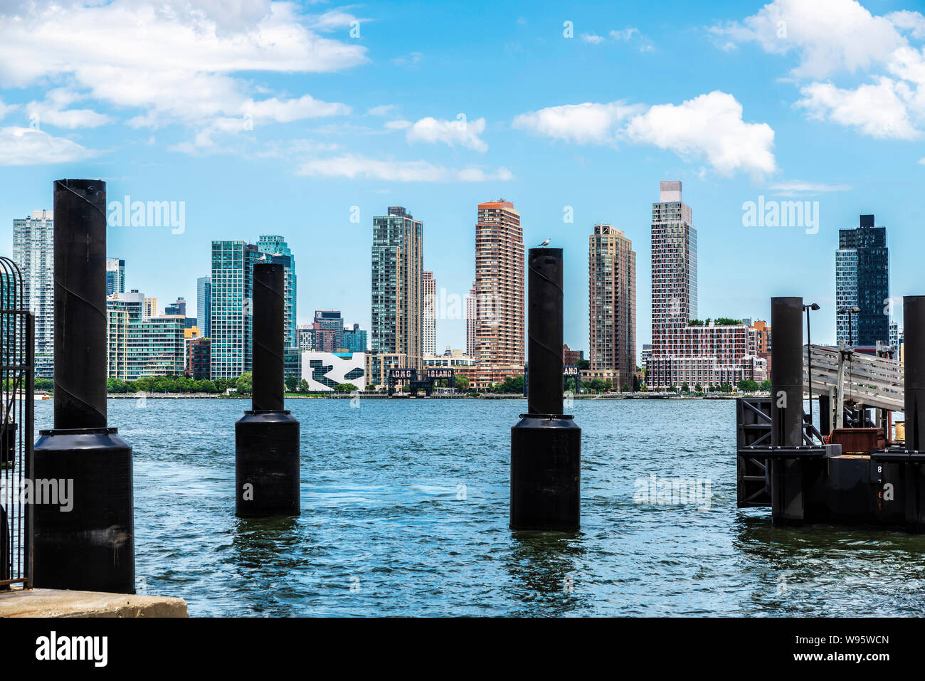 View of the skyline of modern skyscrapers of Long Island from Manhattan jetty in New York City, USA Stock Photo