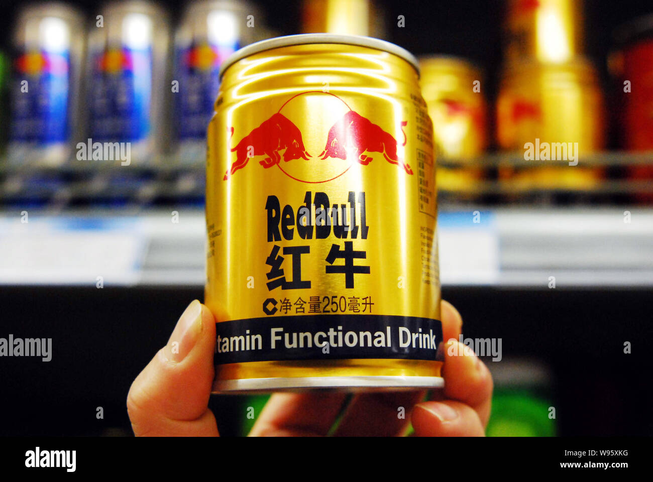 A Customer Buys A Can Of Red Bull Energy Drink At A Supermarket In Jiujiang City East Chinas Jiangxi Province 12 February 12 Supermarkets In So Stock Photo Alamy