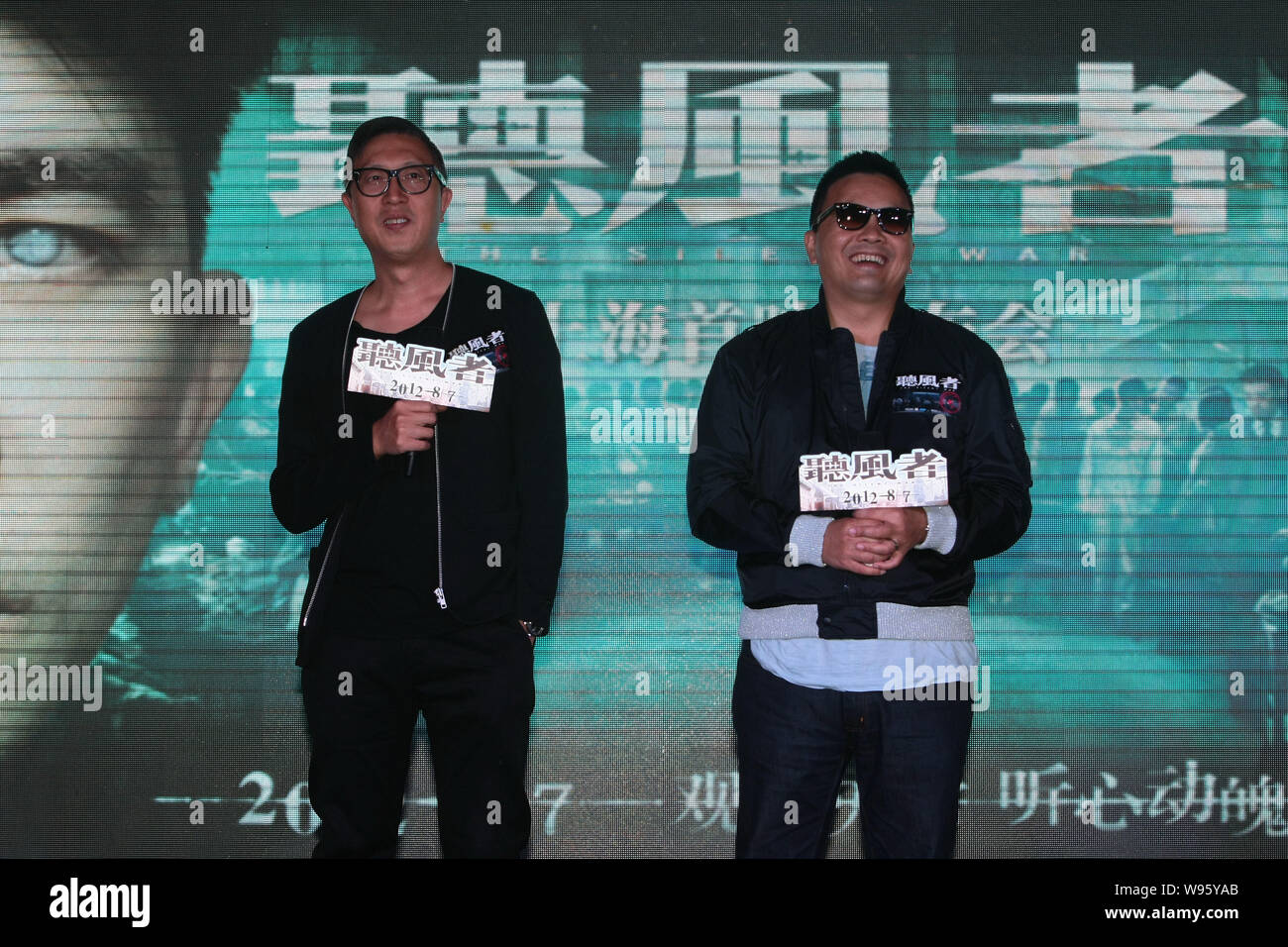 Hong Kong directors Alan Mak Siu Fai, right, and Felix Chong Man-Keung attend a press conference for the movie, The Silent War, in Shanghai, China, 31 Stock Photo