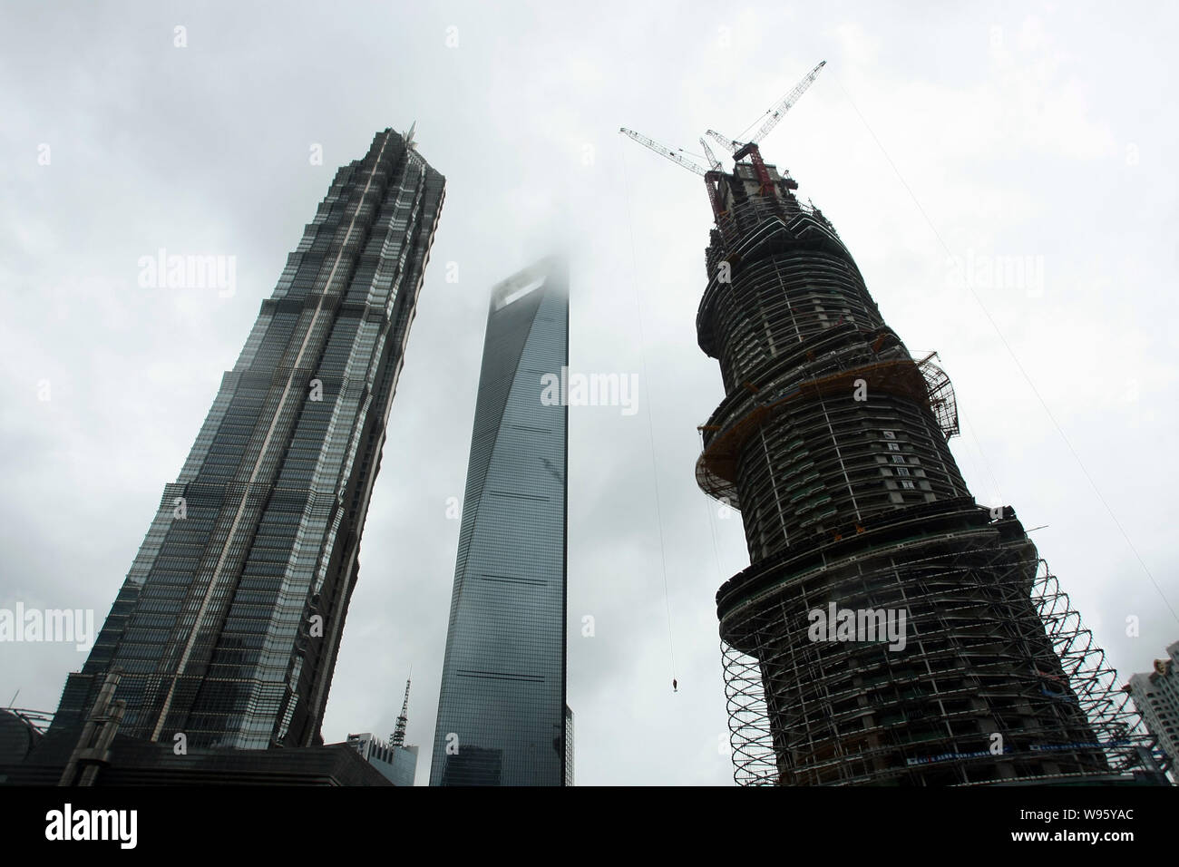 View of the Shanghai Tower (R) under construction in Shanghai, China, 2 ...