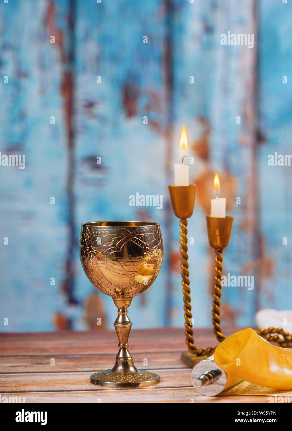 Shabbat challah bread, shabbat wine and candles on Prayer Shawl Tallit