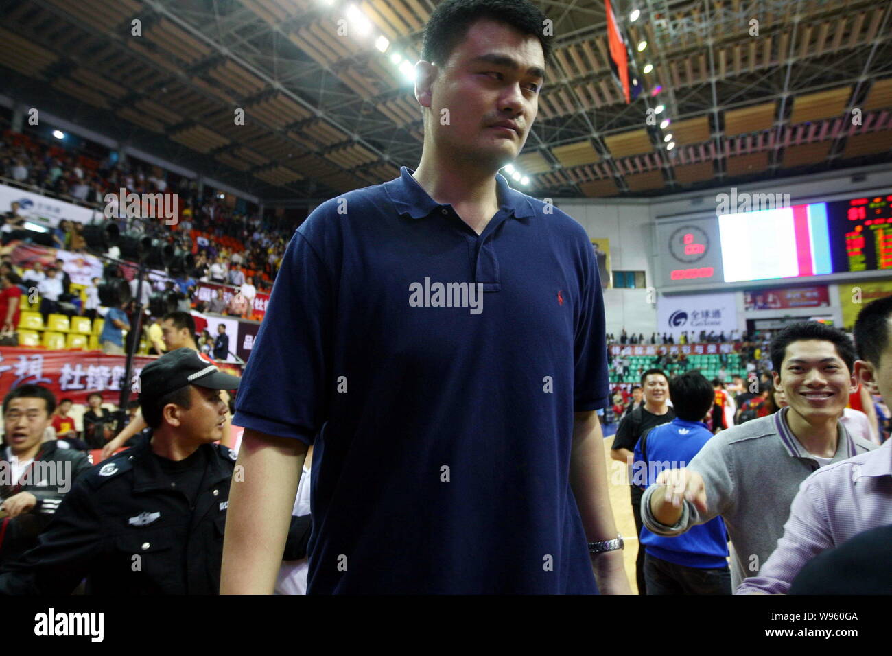Retired Chinas basketball star Yao Ming is pictured during his friends farewell match in Dongguan city, south Chinas Guangdong province, 6 April 2012. Stock Photo