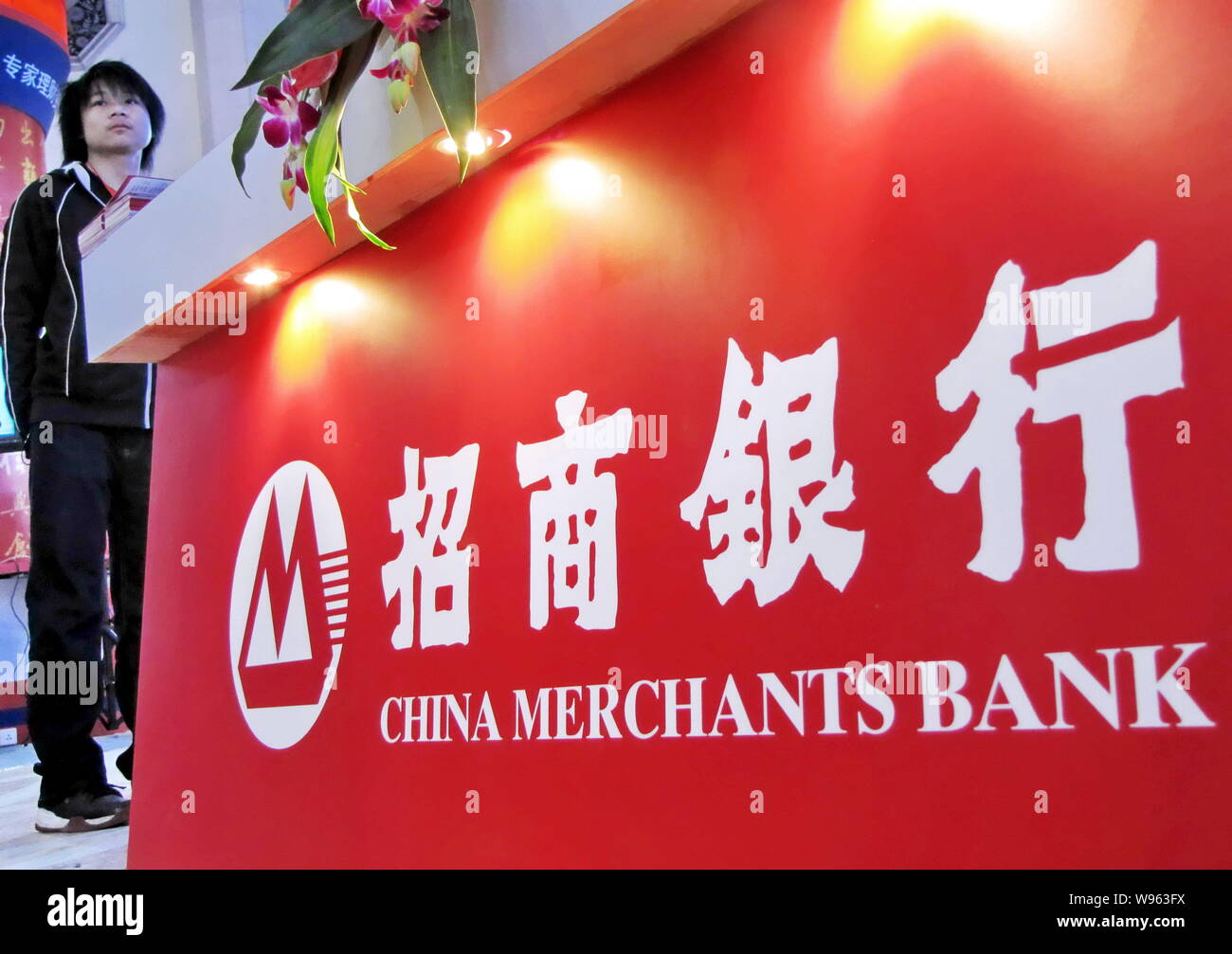 FileA visitor is seen at the stand of China Merchants Bank during