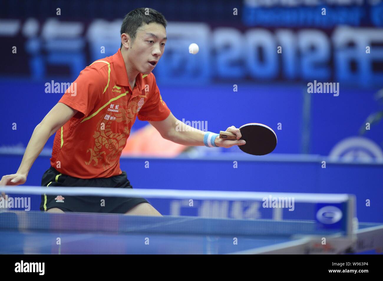 Chinese table tennis player Xu Xin competes during the mens single final at the 2012