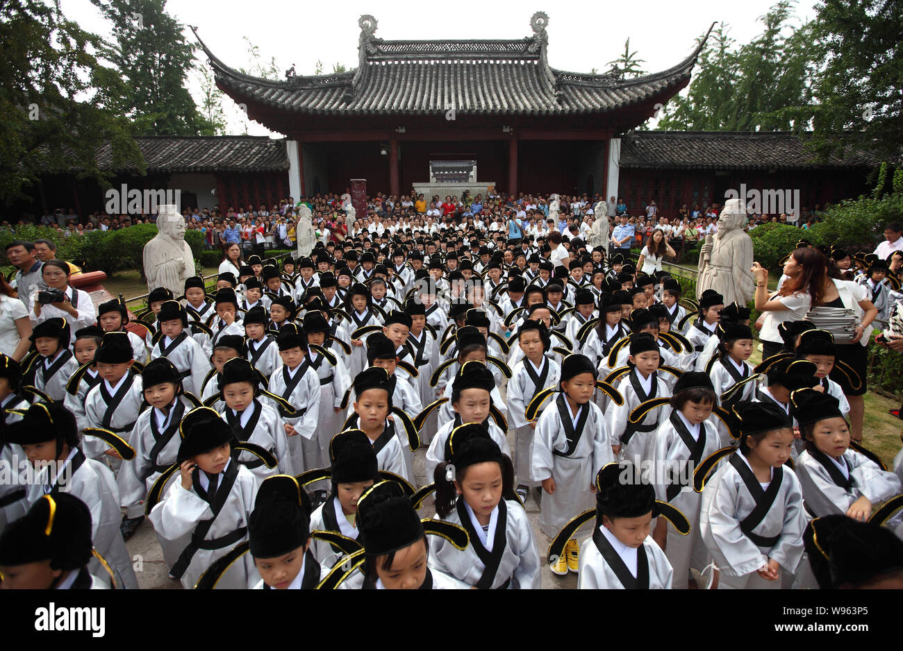 Newly enrolled primary school students, dressed in traditional