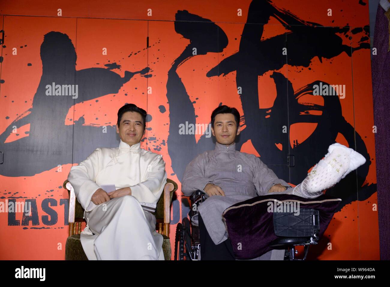 Hong Kong actor Chow Yun-fat, left, and Chinese actor Huang Xiaoming attend the press conference for their latest movie, The Last Tycoon, in Shanghai, Stock Photo