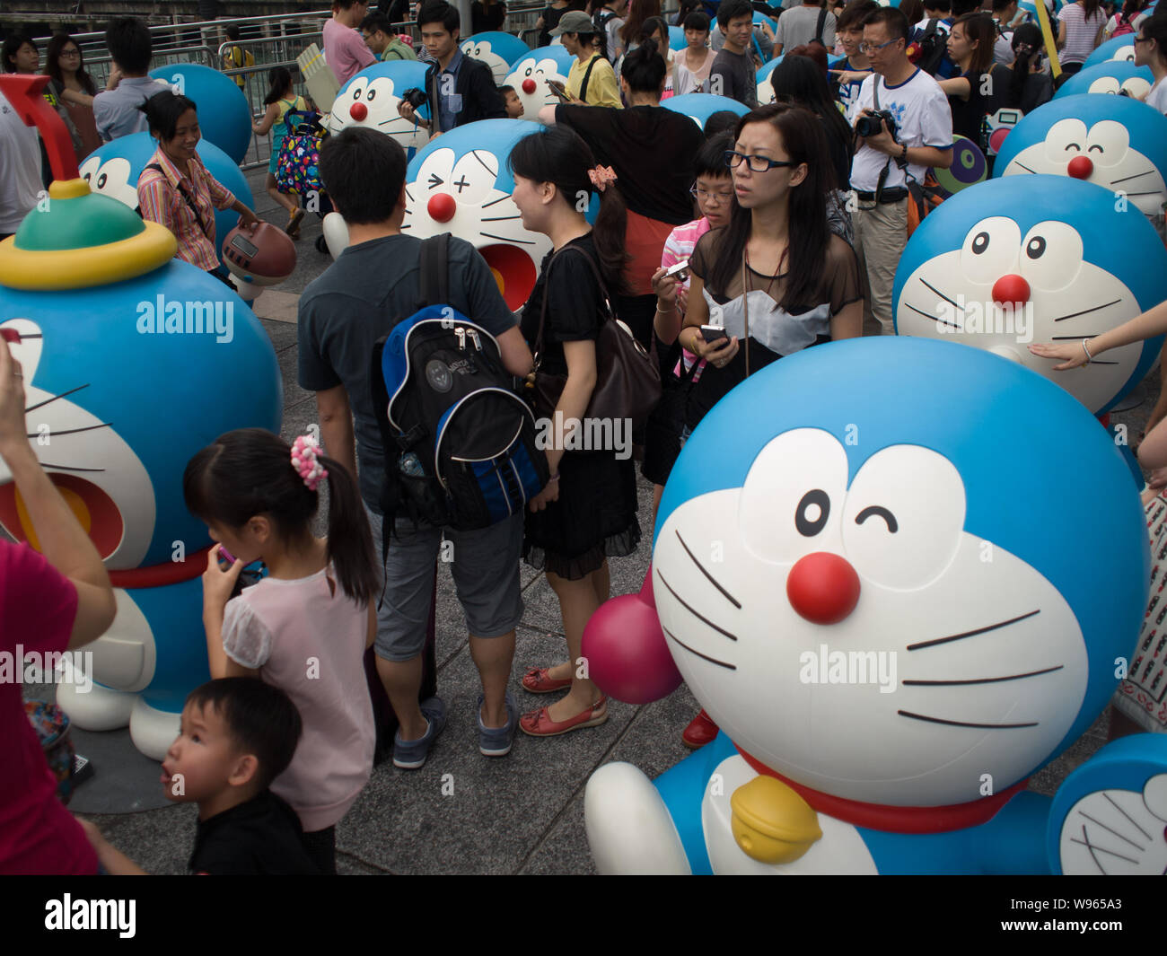 Citizens view models of Doraemon, a famous Japanese cartoon character, at  an exhibition in Hong Kong, China, 26 August 2012 Stock Photo - Alamy