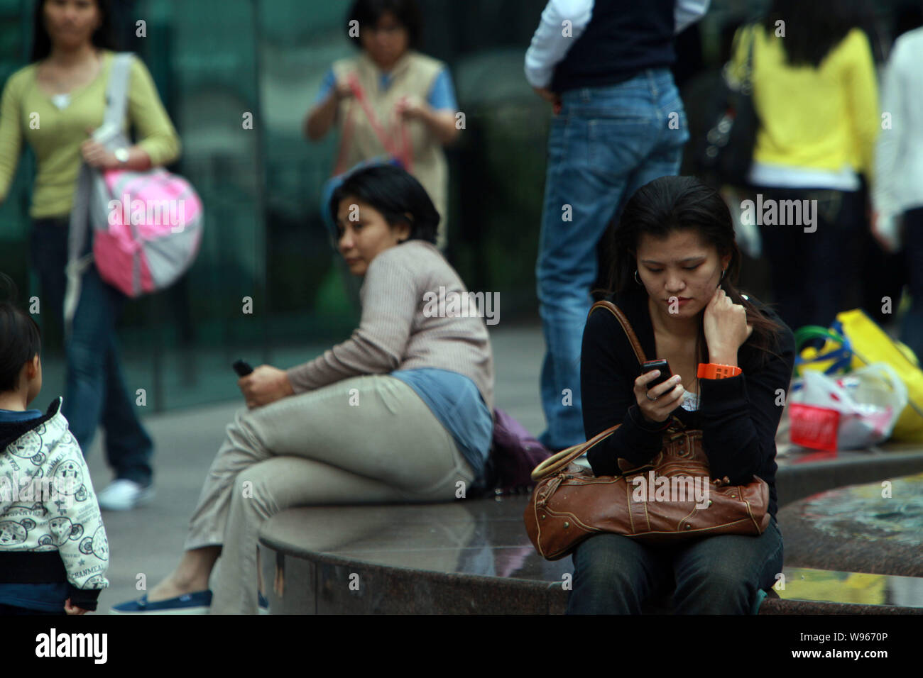 File Filipino Maids Are Seen At A Street In Hong Kong China 8