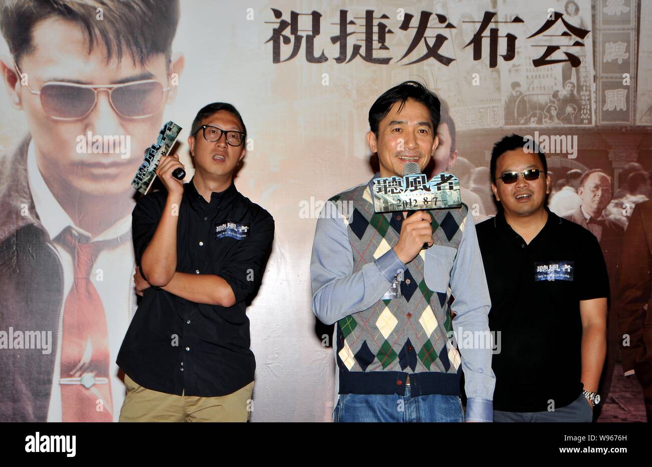 Hong Kong actor Tony Leung Chiu Wai, center, directors Alan Mak Siu Fai, right, and Felix Chong Man-Keung attend a celebrative press conference for th Stock Photo