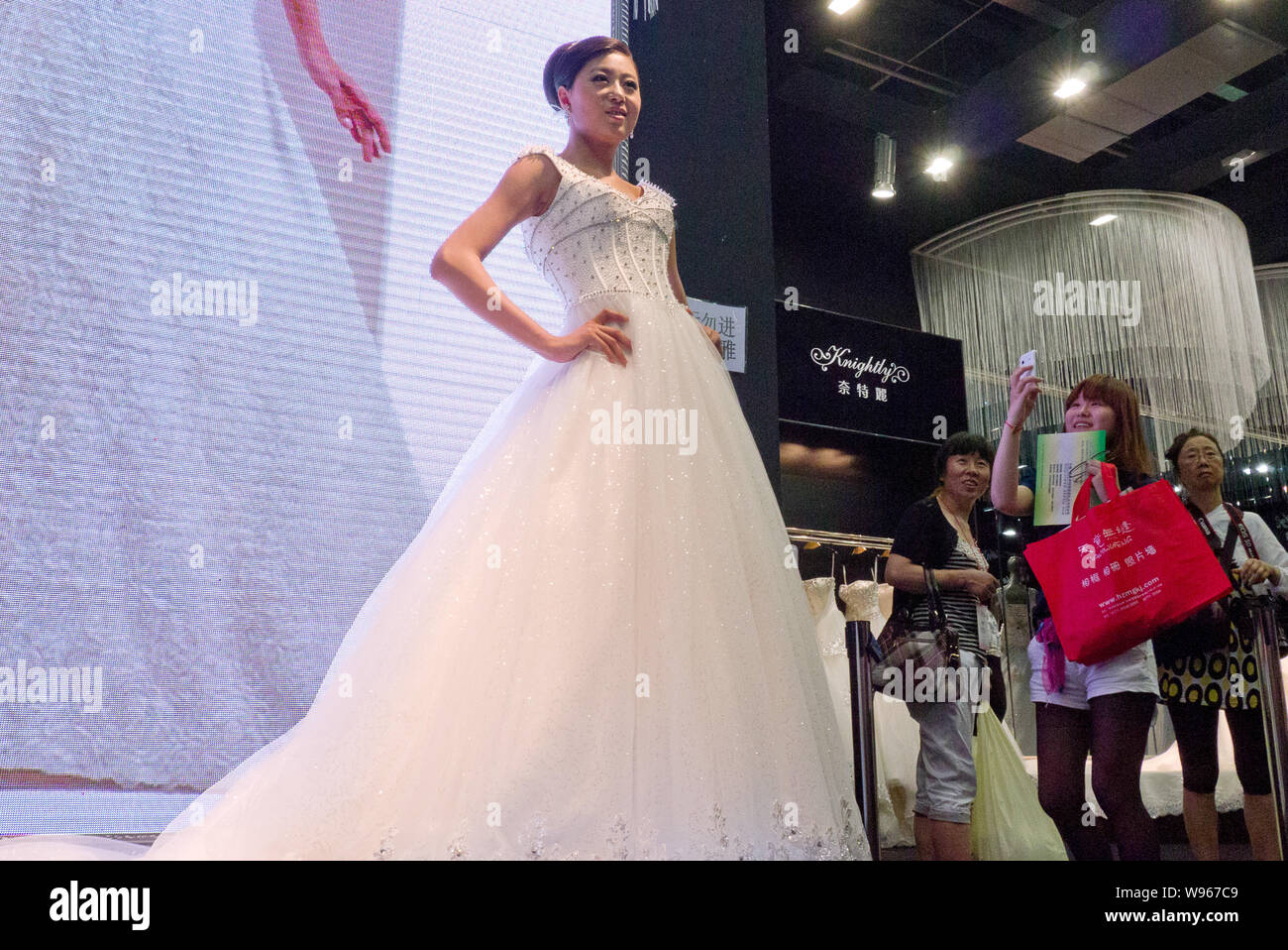 A Chinese Model Displays A Wedding Gown During The 22nd China
