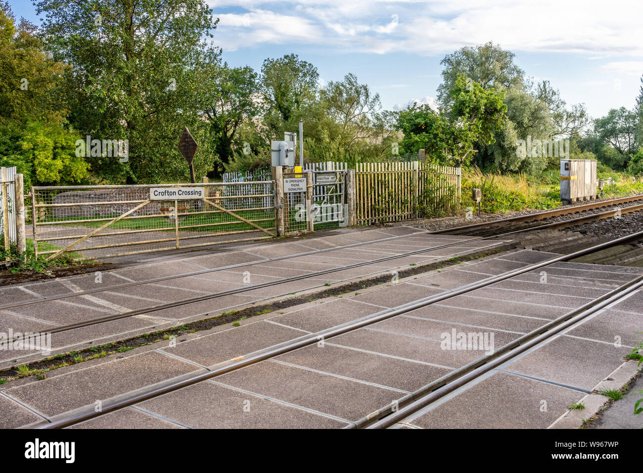 Fence at Crofton railway level crossing in Wiltshire, England, UK Stock Photo