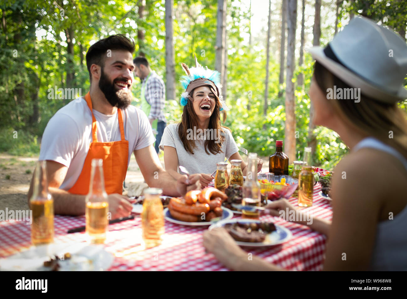 Group of friends having a barbecue party in nature Stock Photo - Alamy