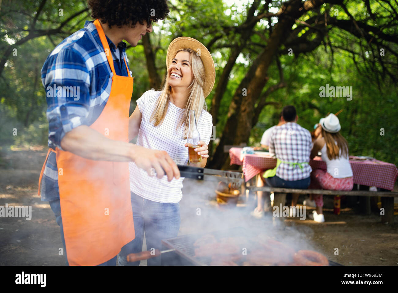 Group of friends having barbecue party in nature Stock Photo - Alamy