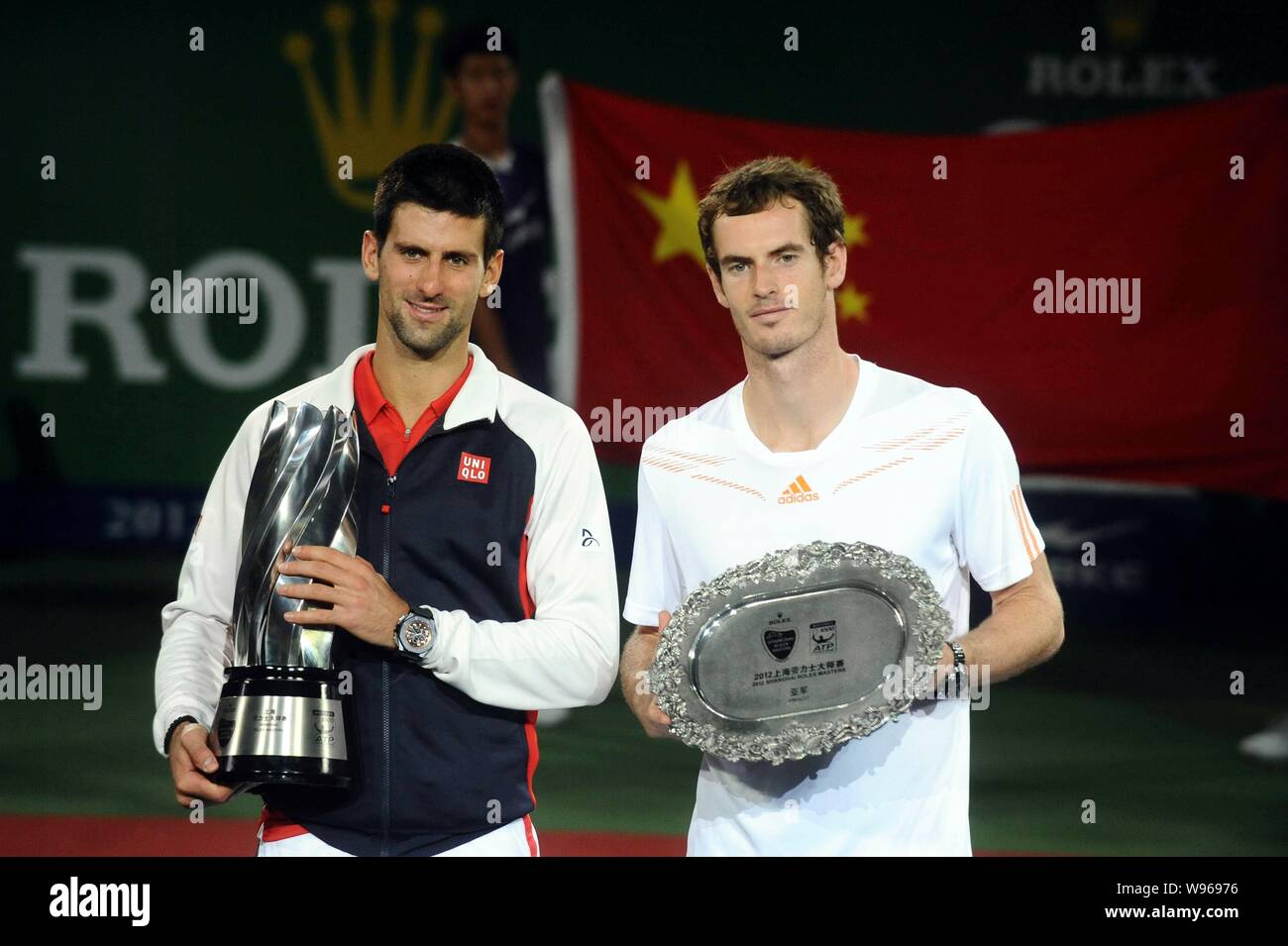 Novak Djokovic of Serbia, left, and Andy Murray of Britain hold their  trophies in the award ceremony after Djokovic defeated Murray in their  final mat Stock Photo - Alamy
