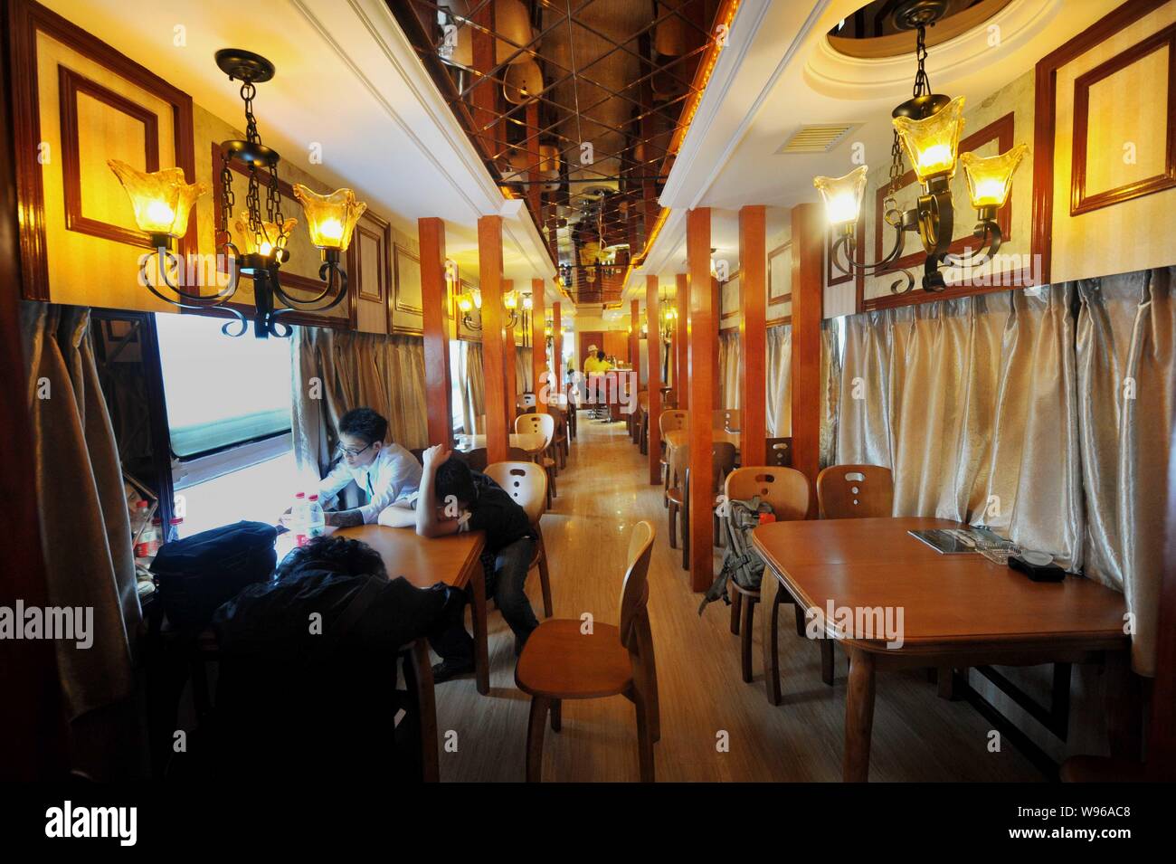 Customers are seen at a restaurant of the train theme hotel in Guiyang city, southwest Chinas Guizhou province, 18 July 2012.   A train theme hotel We Stock Photo