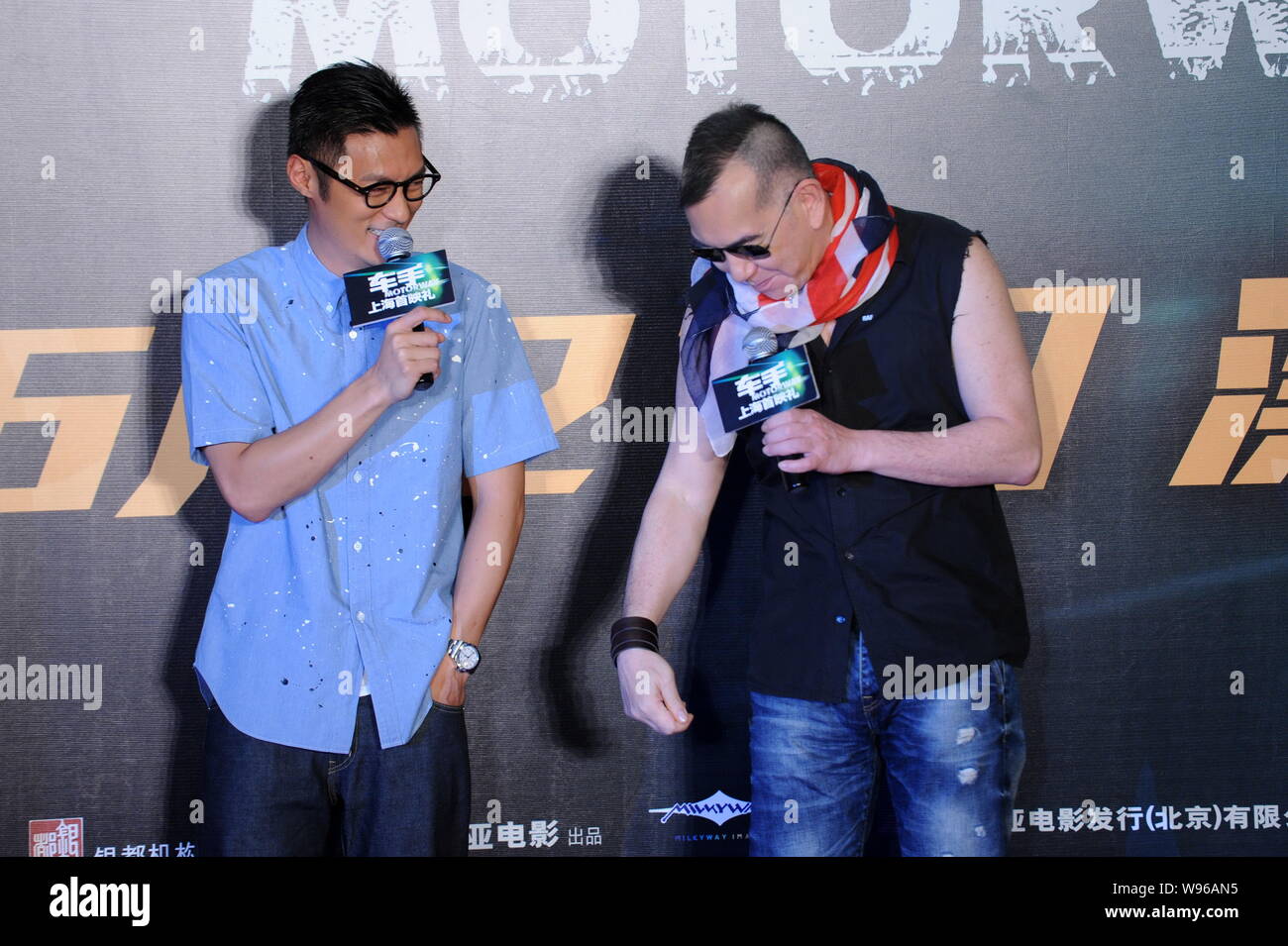 Hong Kong actor Shawn Yue and Anthony Wong speak during a press conference for their new movie, Motorway, in Shanghai, China, 15 June 2012. Stock Photo