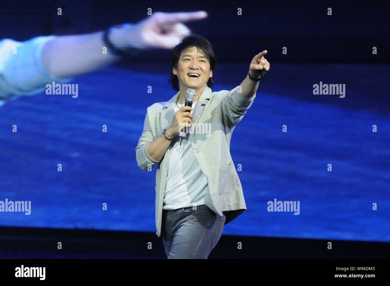 Taiwanese singer Emil Chau performs at a promotional activity in Hangzhou, east Chinas Zhejiang Province, 4 June 2012. Stock Photo