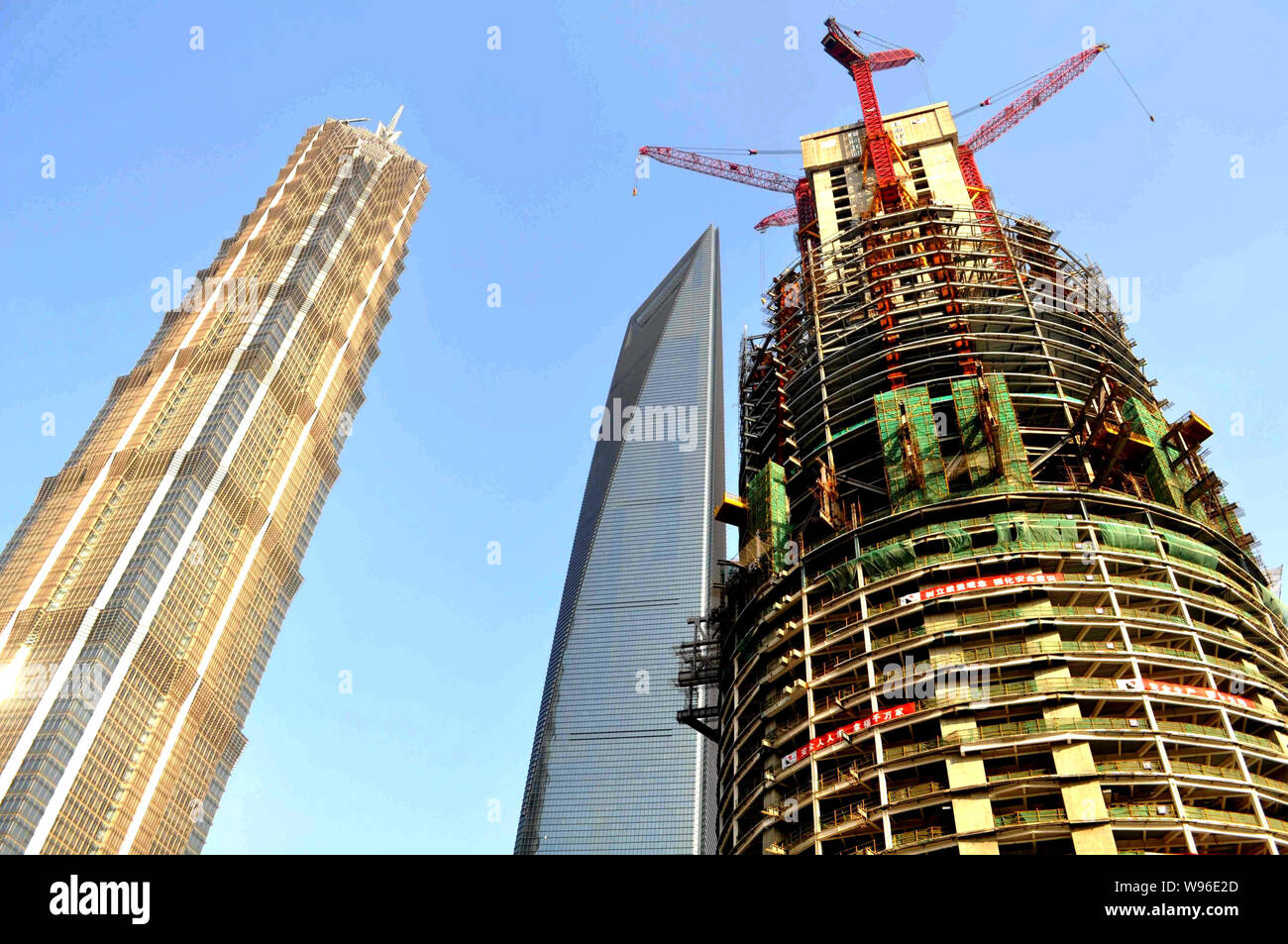 The Shanghai Tower is under construction next to Jinmao Tower, left ...