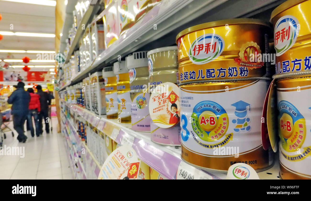 --FILE--Tins of Yili baby milk powder are for sale at a supermarket in Shanghai, China, 2 January 2012.   Dairy giant Yili Group on Thursday (14 June Stock Photo