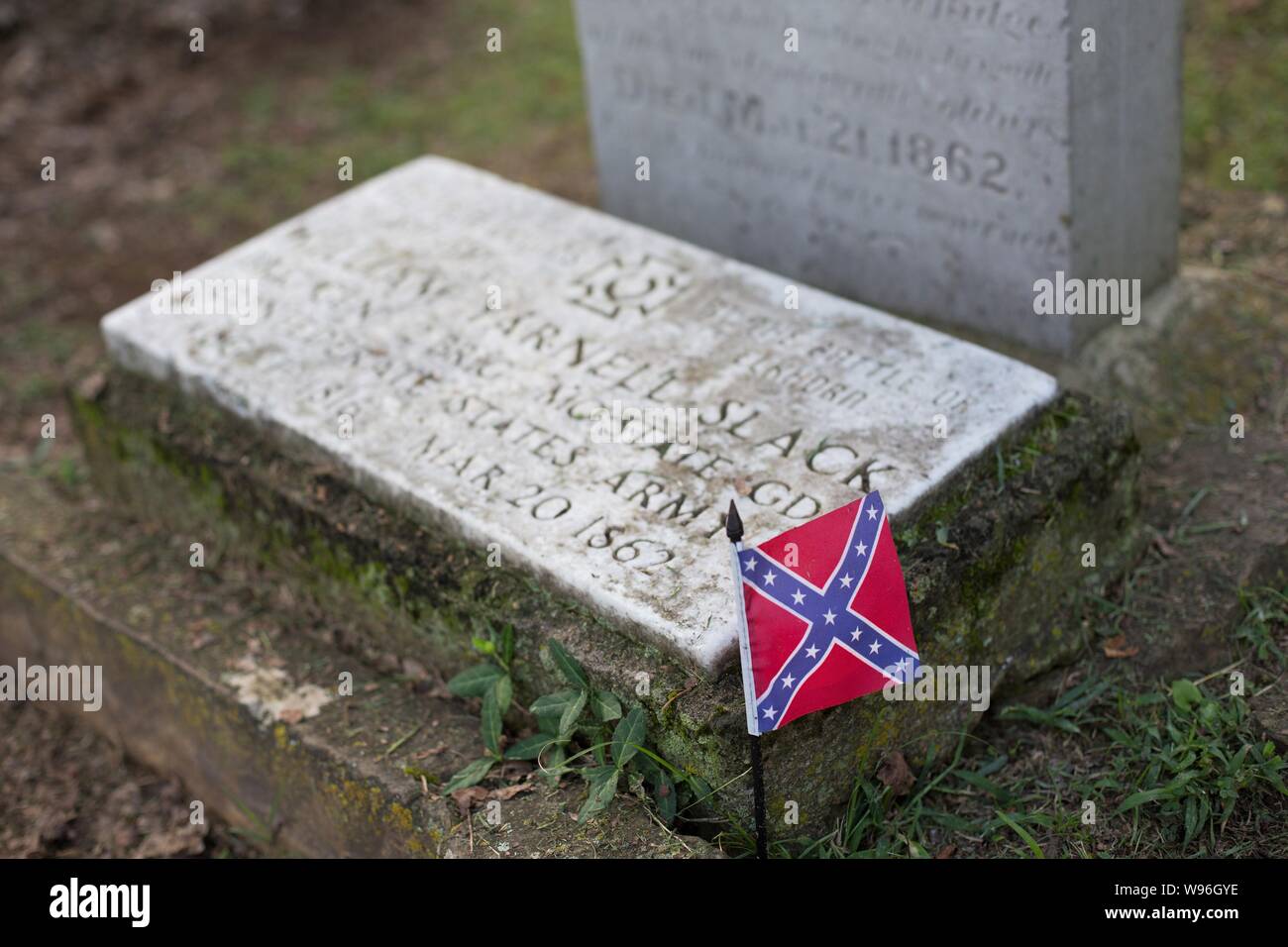A Confederate flag on a grave, at the Confederate Cemetery in Fayetteville, AR, USA. Stock Photo