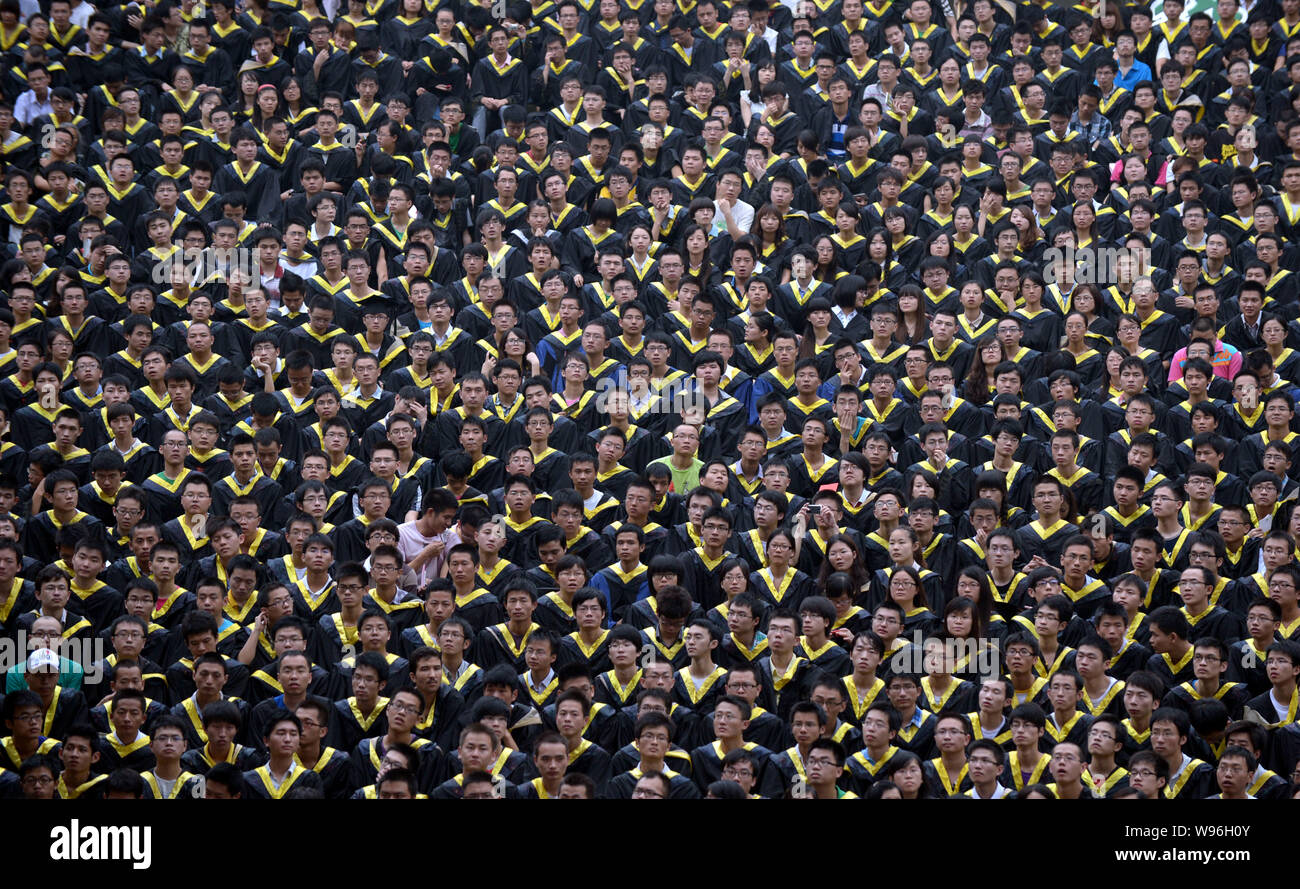 Chinese grads attend a graduation ceremony at Chongqing Unversity in Chongqing, China, 28 June 2012.   A record 6.8 million Chinese students, most of Stock Photo