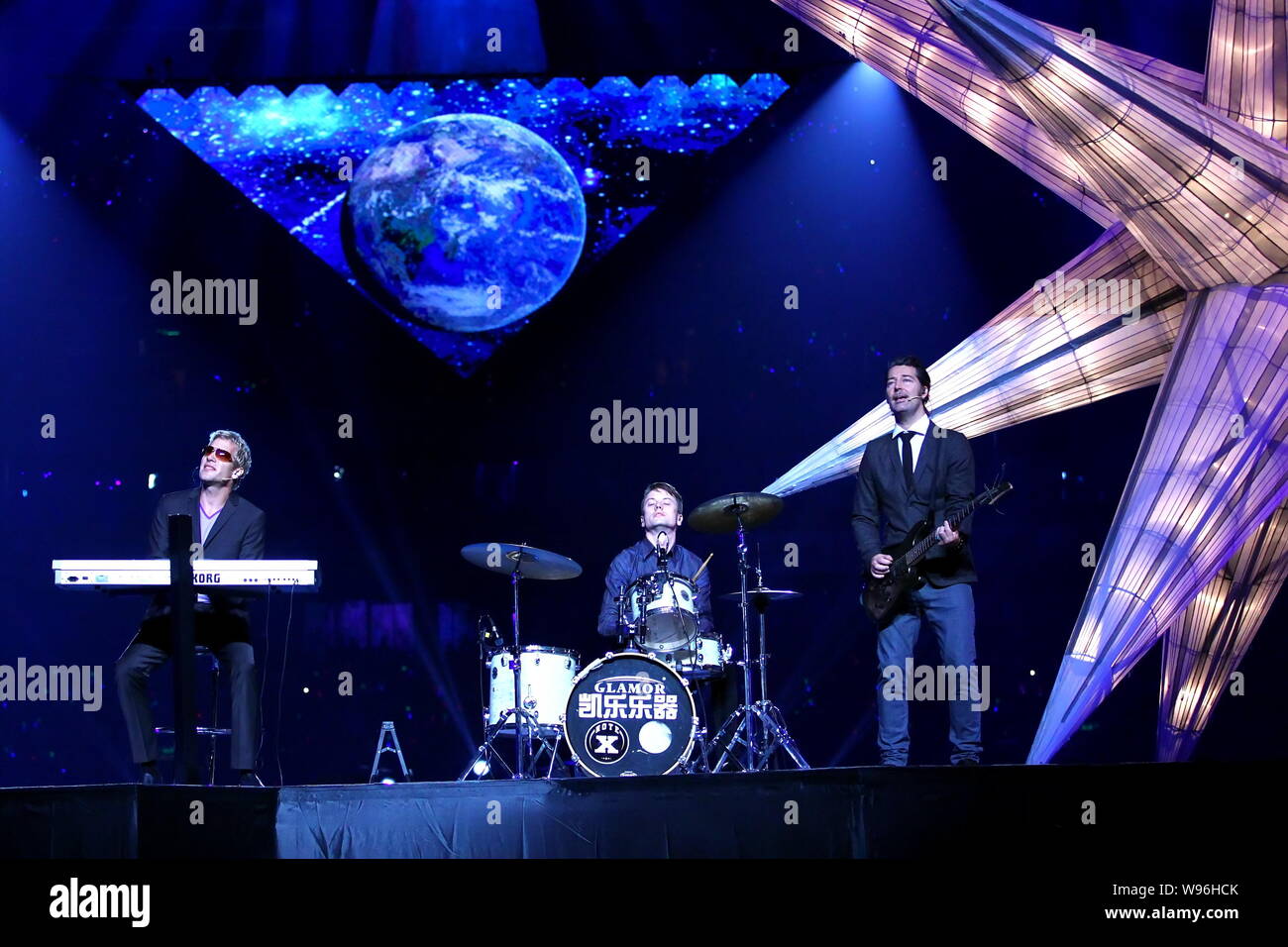 Members of Danish rock band Michael Learns to Rock, also known as MLTR, perform at the opening gala of the 2012 Nanning International Folk Song Arts F Stock Photo