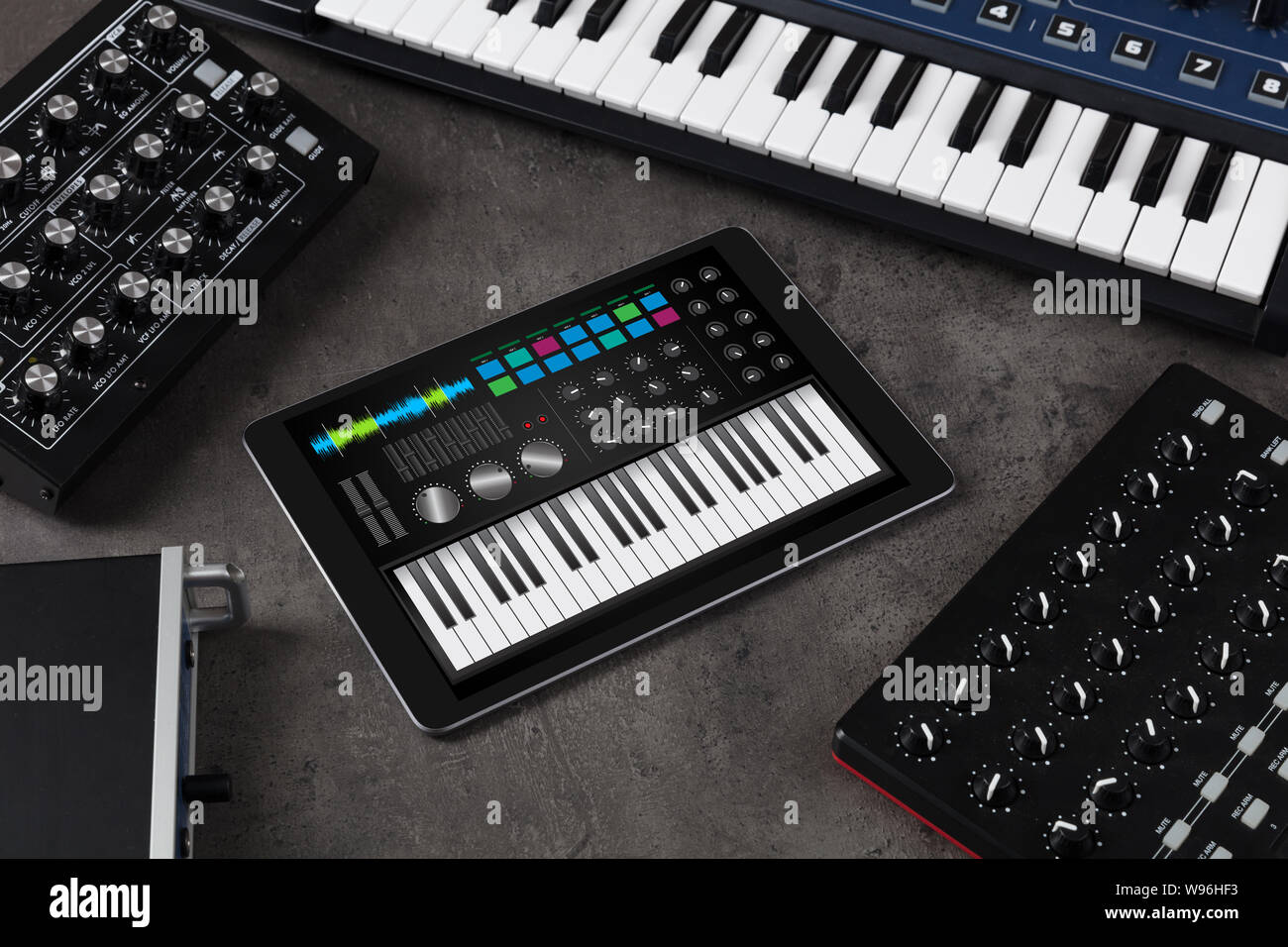 Piano synthesizer app on tablet and musical instrument concept Stock Photo  - Alamy