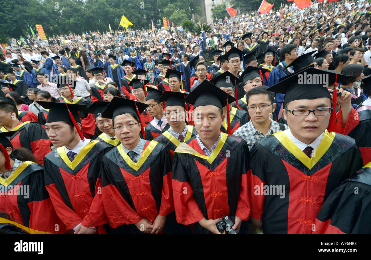 Chinese grads attend a graduation ceremony at Chongqing Unversity in Chongqing, China, 28 June 2012.   A record 6.8 million Chinese students, most of Stock Photo