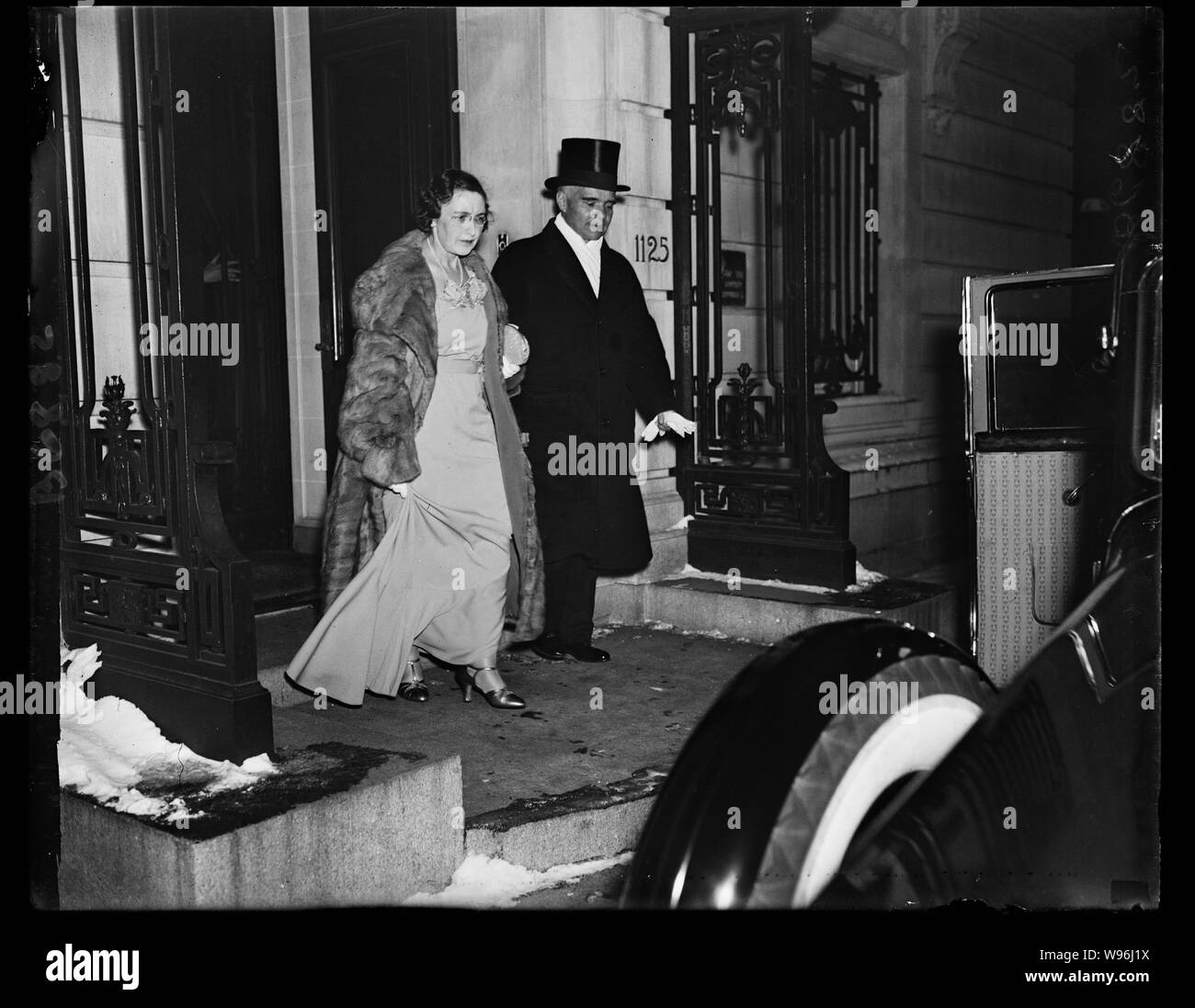 Ambassador and Madame Alexander Troyanovsky English: Off to White House. Ambassador and Madame Alexander Troyanovsky of the U.S.S.R., leaving the Embassy on 16th St., to attend the White House dinner given to the diplomatic corps. Ambassador Troyanovsky returned to Washington Thursday from a trip to his homeland so that he and his wife could attend the dinner. 1/24/35. Stock Photo