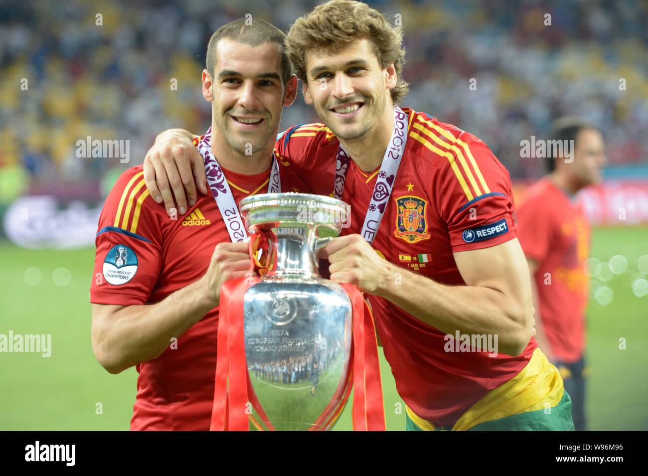 Fernando Llorente, right, and Alvaro Negredo of Spain hold the trophy after Spain defeated Italy 4-0 in the final match of the UEFA European Football Stock Photo