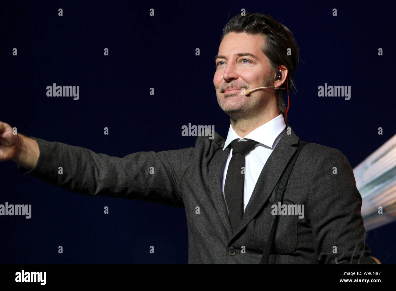 A member of Danish rock band Michael Learns to Rock, also known as MLTR, performs at the opening gala of the 2012 Nanning International Folk Song Arts Stock Photo