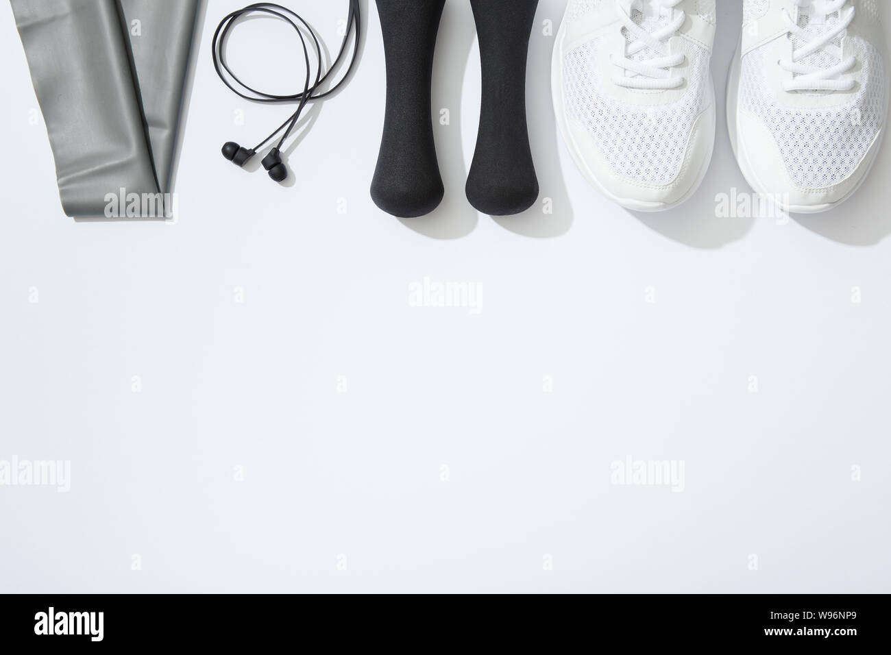 Sport flat lay with gym equipment accessories on white background Stock Photo