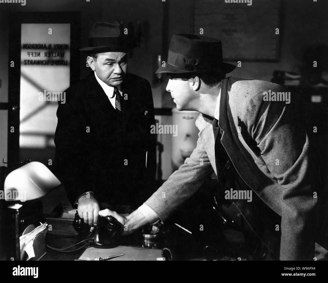 EDWARD G. ROBINSON and FRED MacMURRAY in DOUBLE INDEMNITY 1944 director Billy Wilder screenplay Billy Wilder and Raymond Chandler novel James M. Cain Paramount Pictures Stock Photo