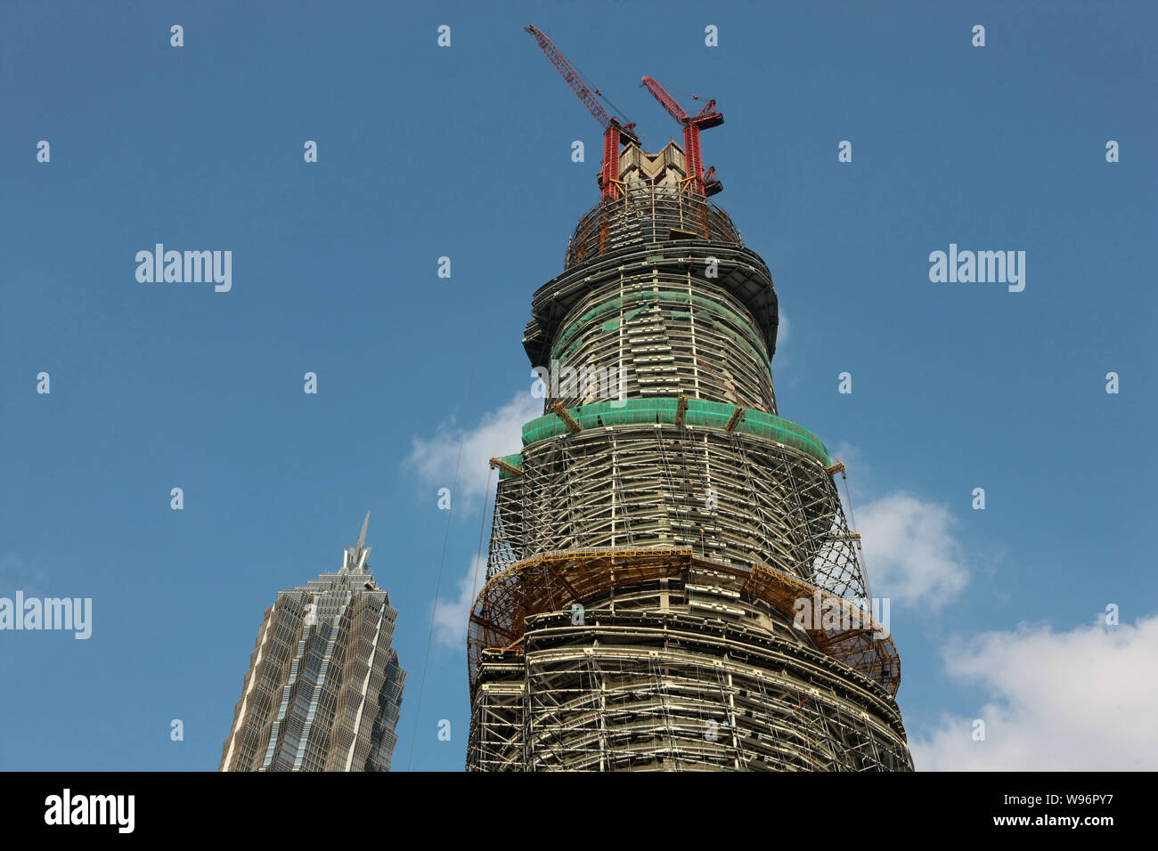 The Shanghai Tower, right, is under construction next to Jinmao Tower ...