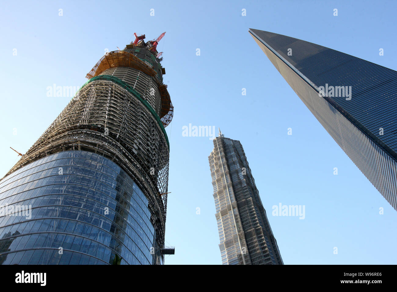 The Shanghai Tower, left, is under construction next to Jinmao Tower ...