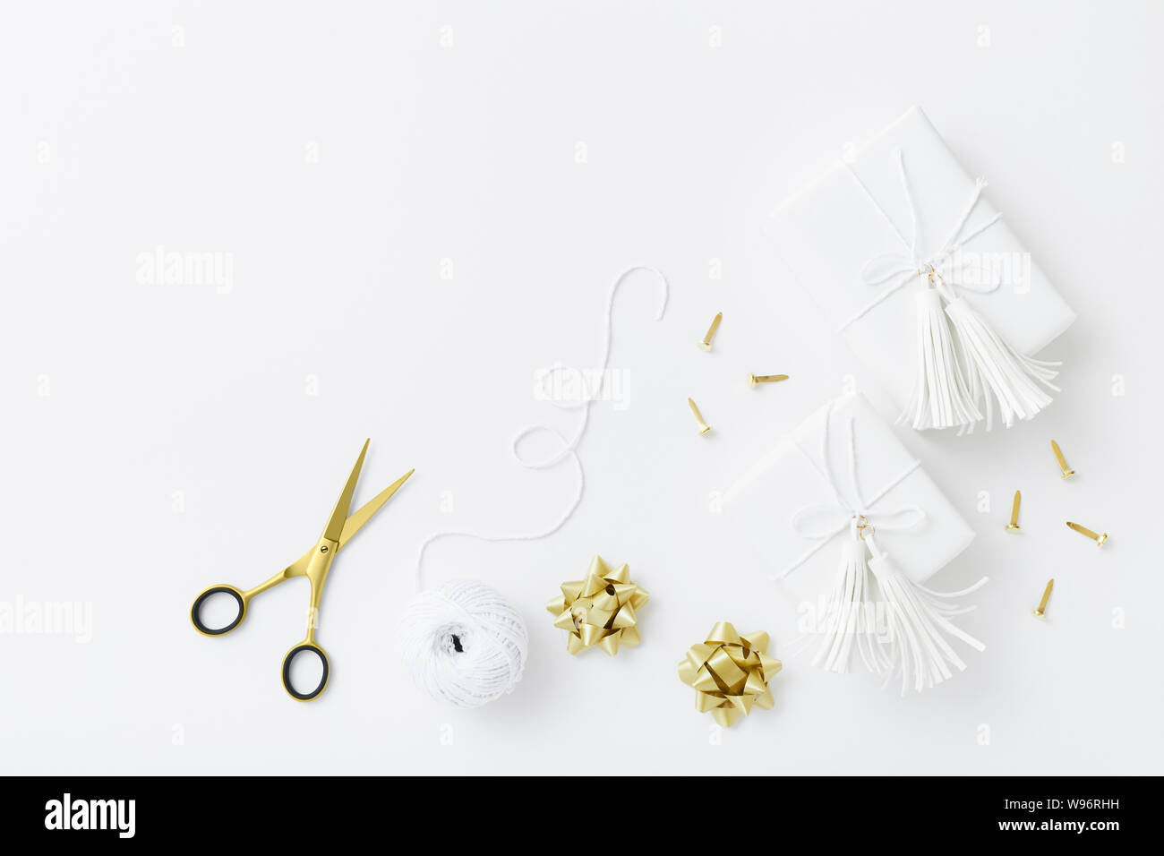 White gifts wrapping flat lay on white background with copy space Stock Photo
