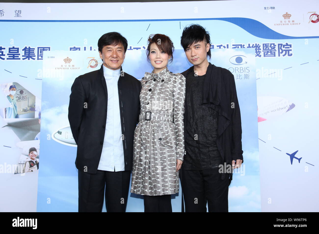 Hong Kong actor Jackie Chan, singer Joey Yung and Leo Ku pose during a  charity event in Hong Kong, China, 24 May 2012 Stock Photo - Alamy